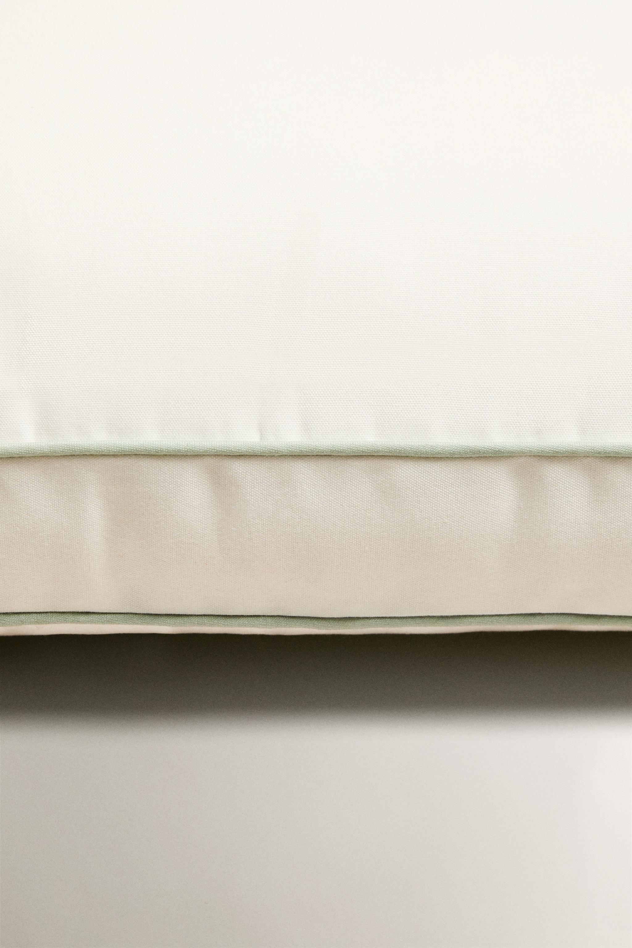 OUTDOOR CHAIR CUSHION WITH PIPING